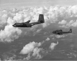 A OV-1 Mohawk is refueled by a C-7 Caribou during the Vietnam war. Click image to enlarge.