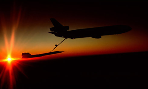 KC-135 Refueling SR-71 Blackbird at sunset.